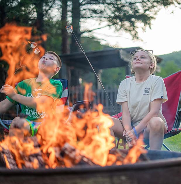 Two Kids Enjoying Marshmellow at Campfire